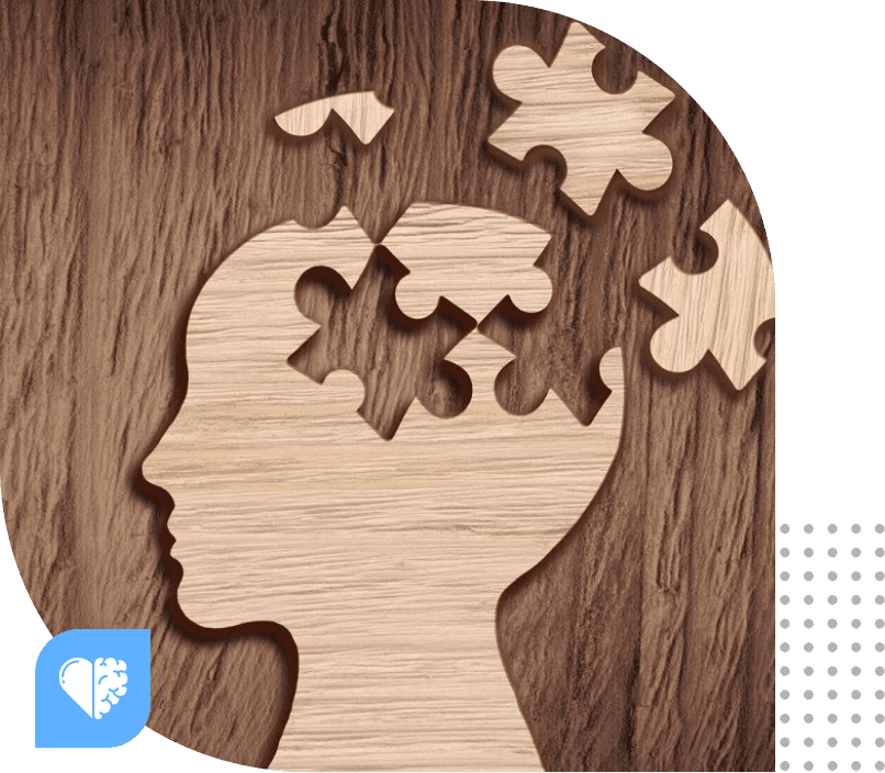 A wooden puzzle piece in the shape of a head.